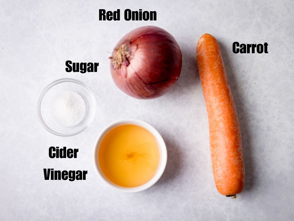 Ingredients for pickled red onion and carrot on a light grey background.