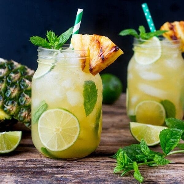 2 Pineapple Ginger Mojitos in mason jars