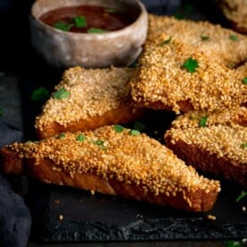 Prawn toast on a black serving board