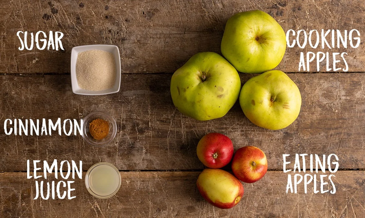 Ingredients for the apple crumble filling on a wooden background.