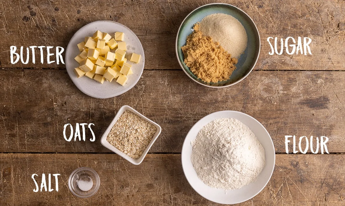 Crumble topping Ingredients on a wooden background.