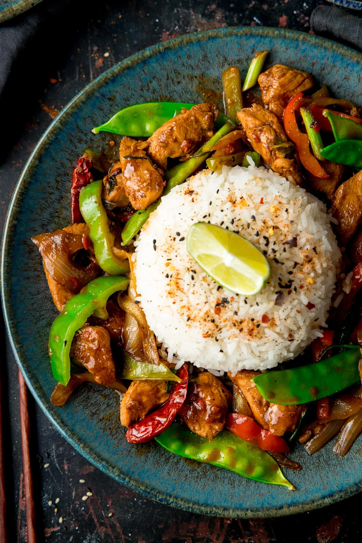 Overhead image of Firecracker chicken and rice on a blue plate