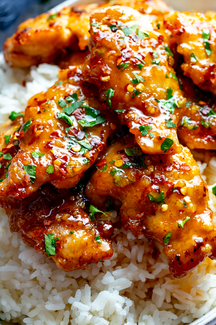 close up of honey garlic chicken on rice